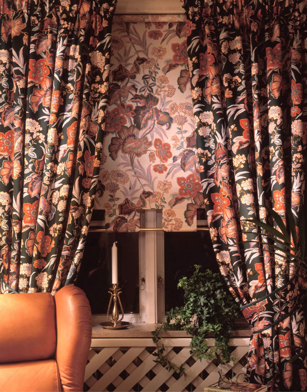 Several fabrics and curtains displayed, in floral patterns and solid colours.