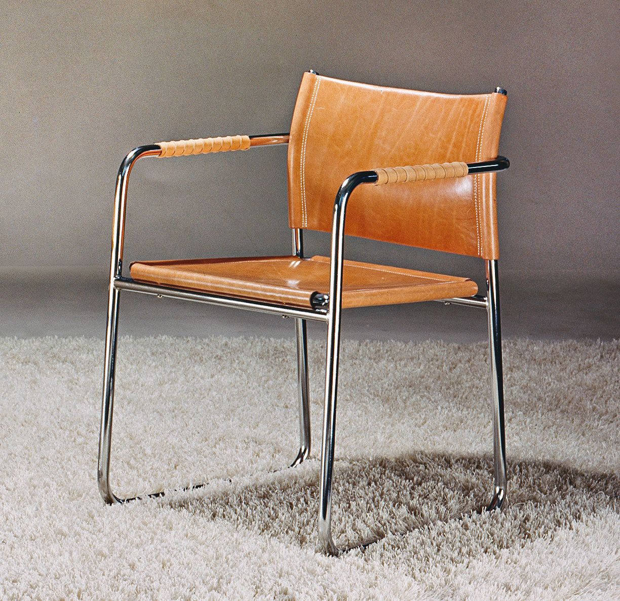 Armchair in fully welded, chrome-plated steel tubing with beige leather seat, back and armrests AMIRAL.