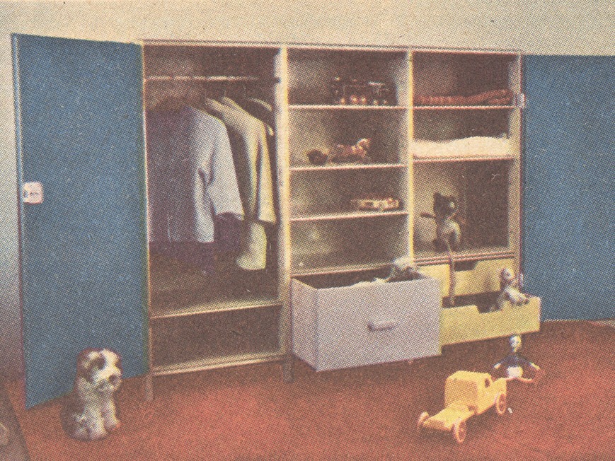 Clothes and toys in a wide wardrobe, model TOY, with blue doors on either side and a mid-section with shelves, no door.