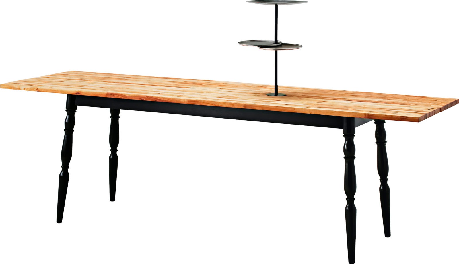 Dining table with a top in solid oiled wood with a tray stand and black turned legs.