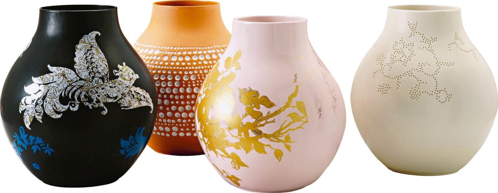 Four rounded vases in different patterns and colours, including pink with gold decorations and black with white decorations.