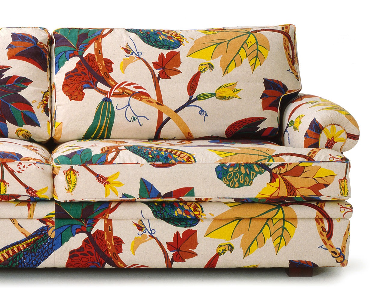 Sofa with bold multi-coloured floral pattern.