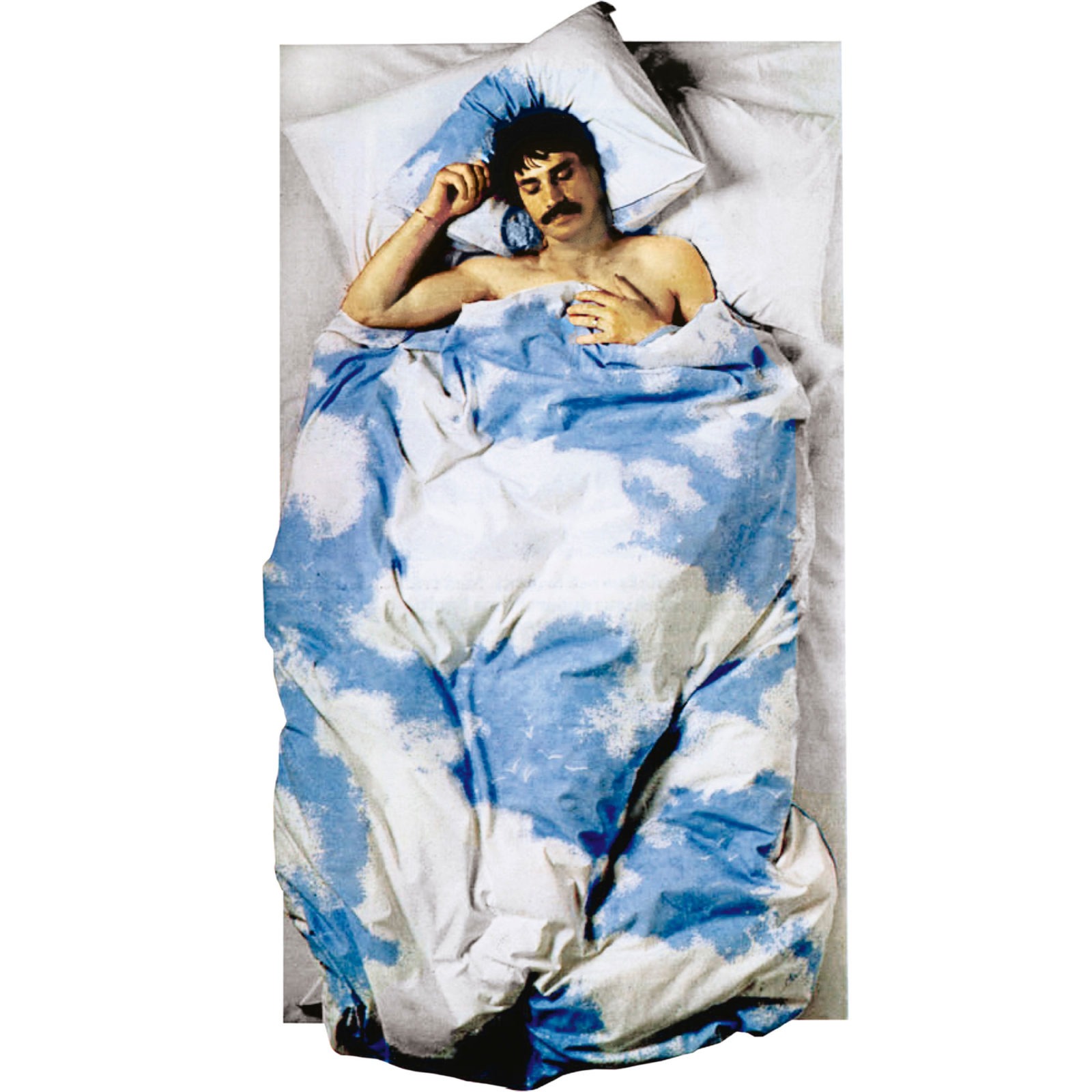 Man seen from above, sleeping in bed under duvet with a pattern showing white clouds on blue sky.