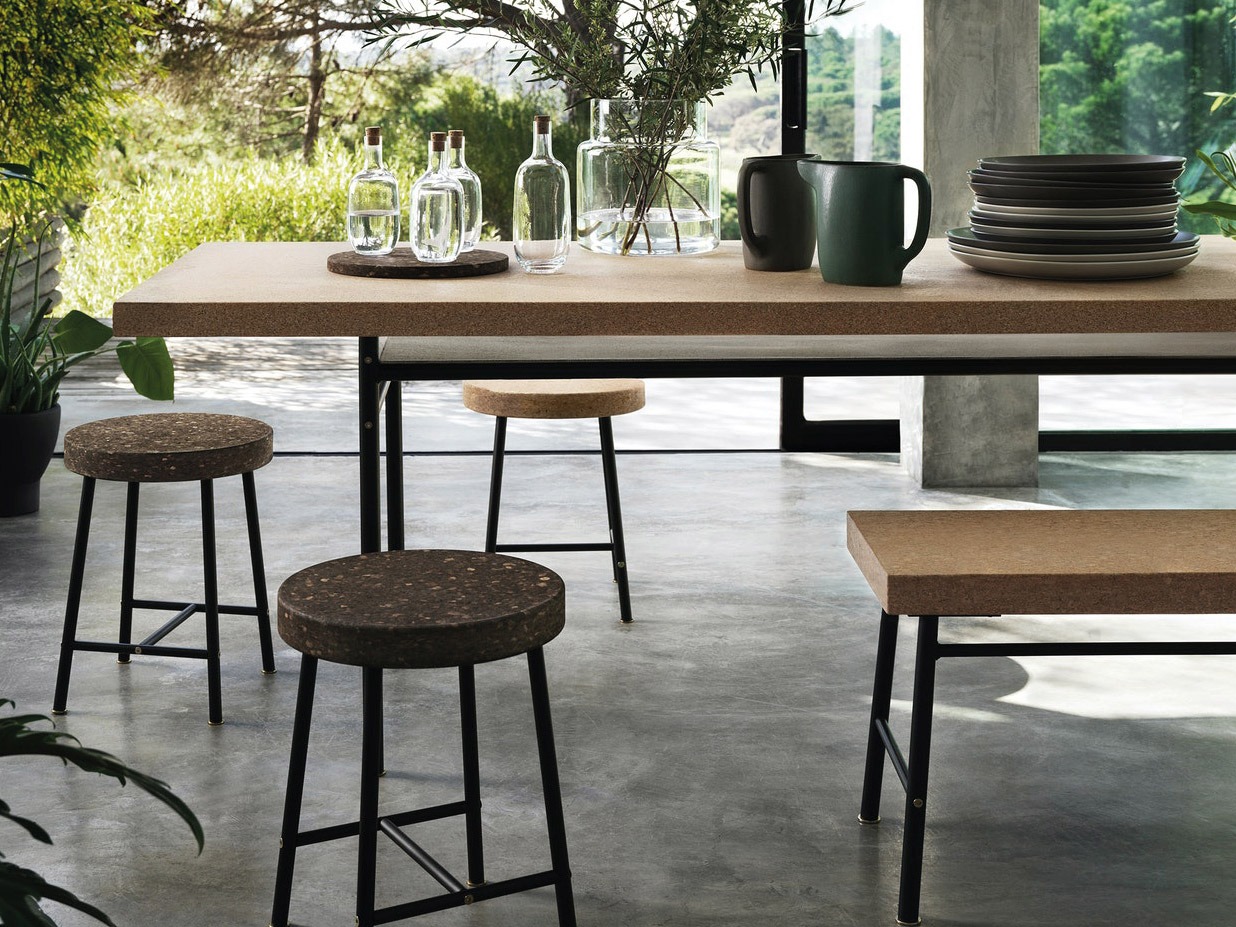 Stylish furniture, tables and stools, in the IKEA series SINNERLIG in light and dark cork, wood and metal.