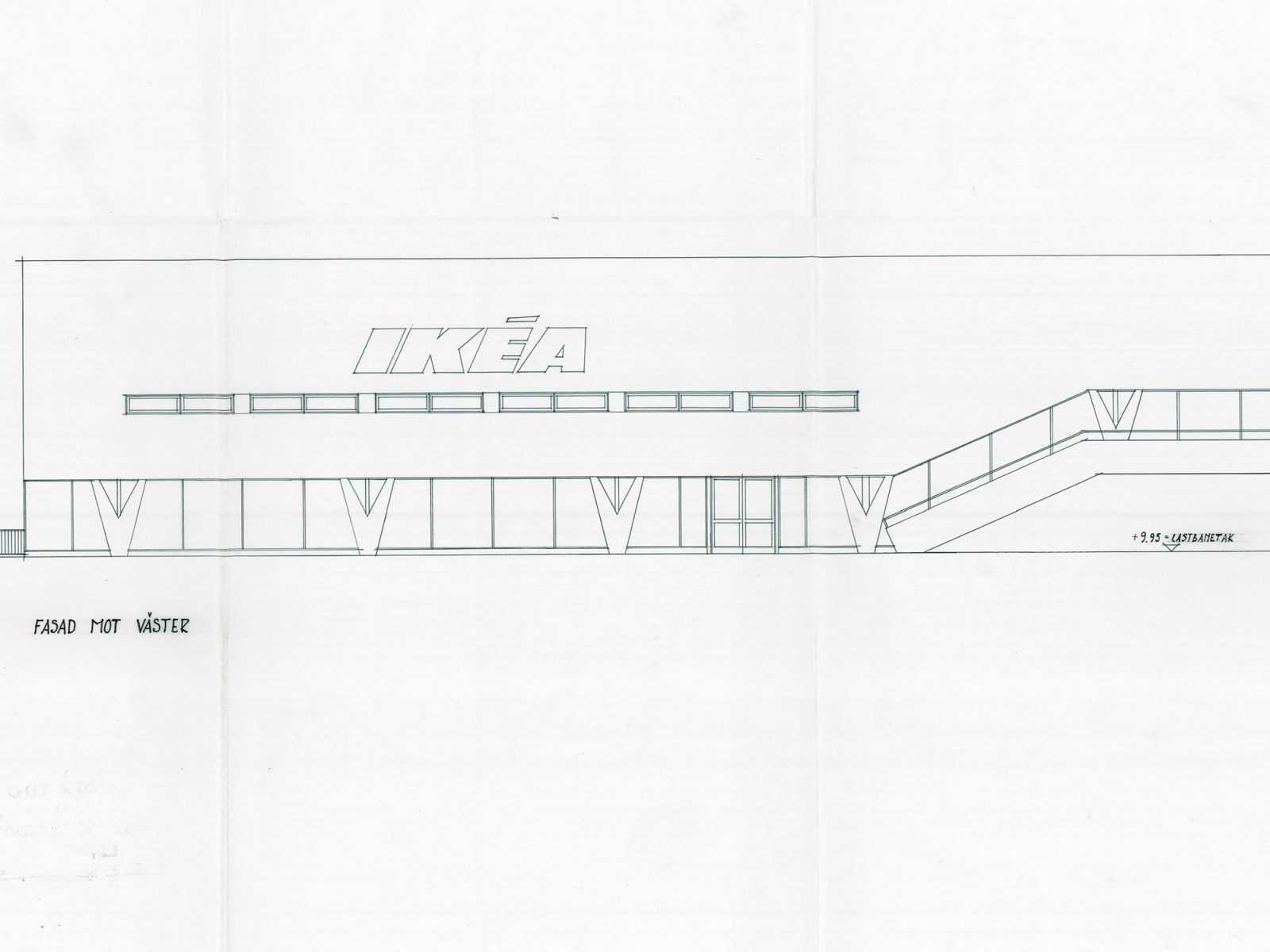 Architectural drawing of low building with archade with large shop windows, V-shaped columns, an IKEA sign on facade.