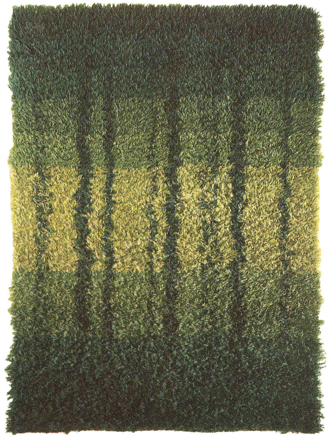 The rya rug SKOGSBRYNET in different green shades.