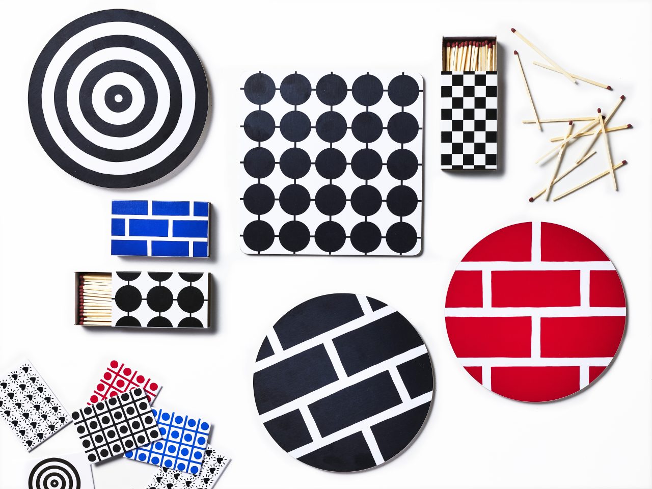 Tray, matchbooks, stickers, and pot coasters in a variety of colours and graphic patterns.