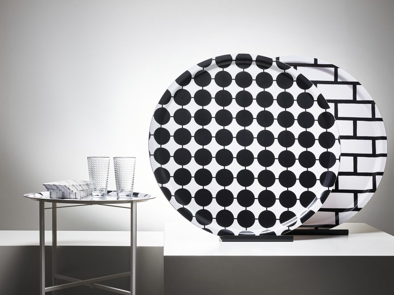 Umbrellas in different graphic patterns in red/white, black/white or grey/white.