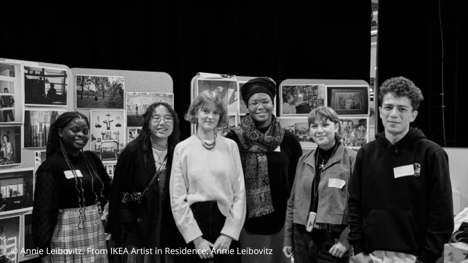 Six trainees lined up for a presentation. The image is in black and white.