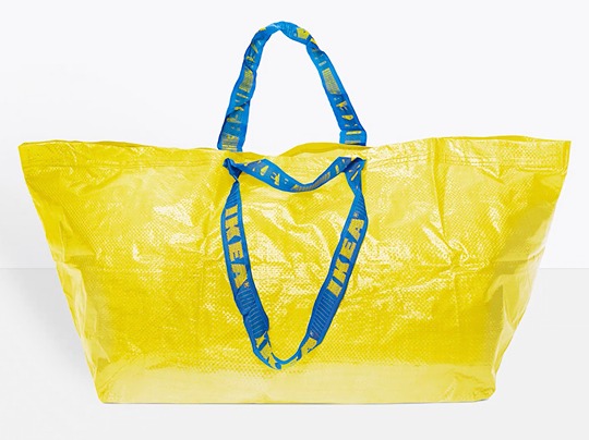 Yellow IKEA carrier bag in plastic material with blue handles.