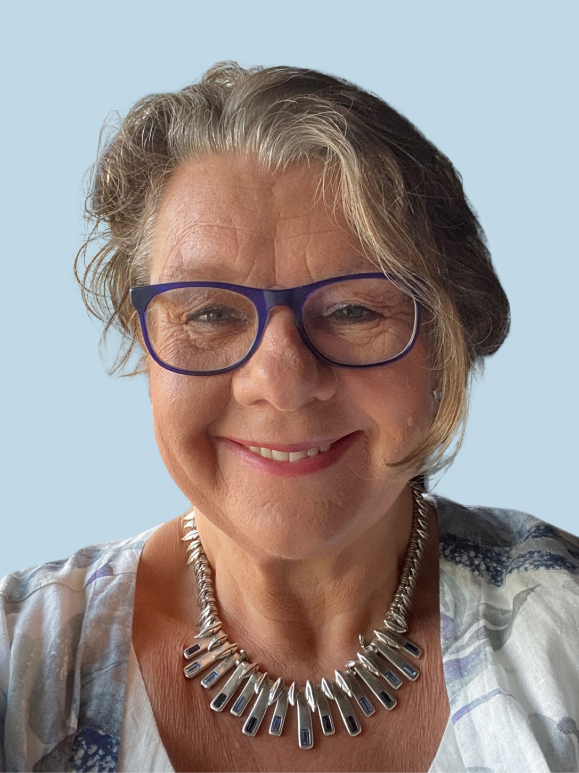 A smiling, grey-blonde woman with glasses, Eva-Carin Banka Johnson.