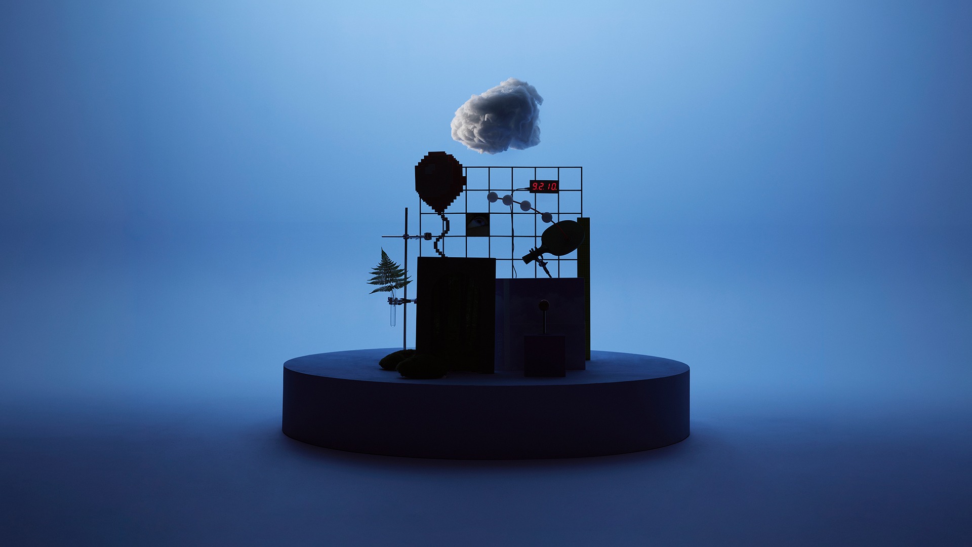 Playful exhibition elements appear as dark silhouettes against a blue background.